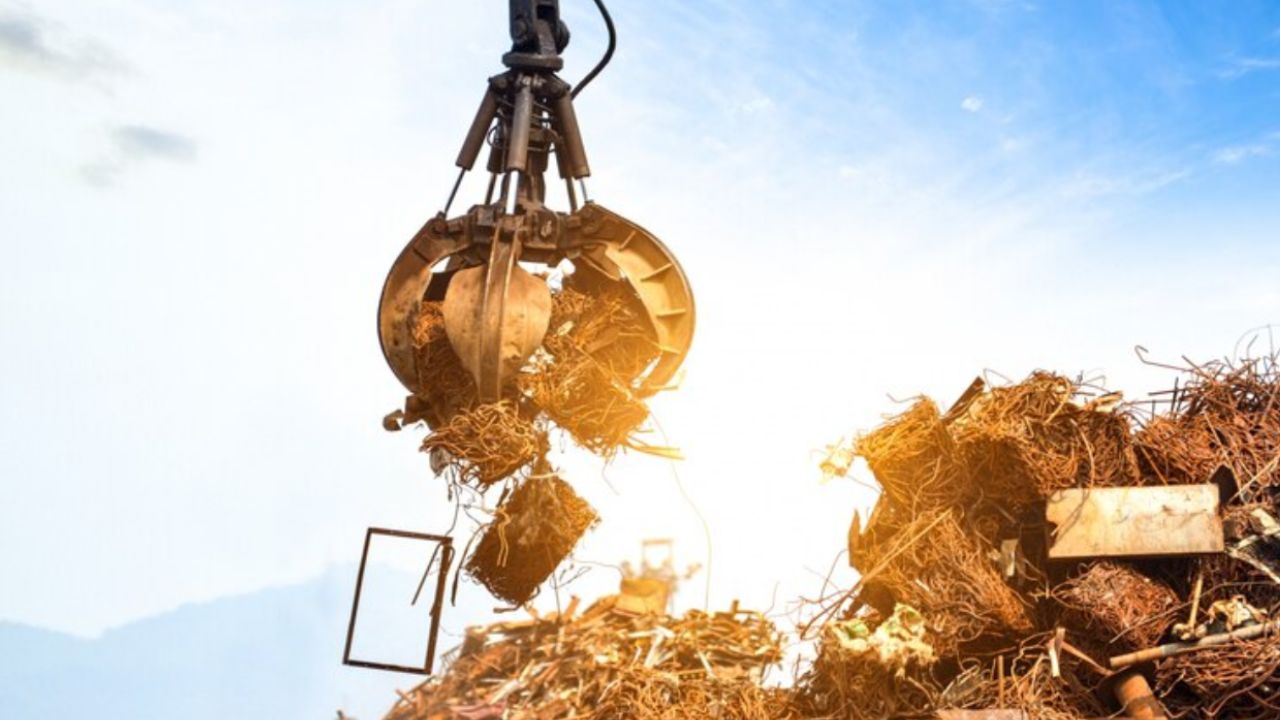 Cleaning up metal waste from a jobsite.