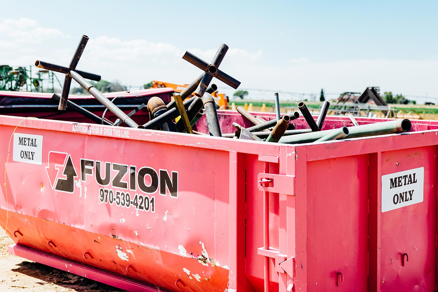 Fuzion Field Services’ scrap recycling bin, ready for pickup.