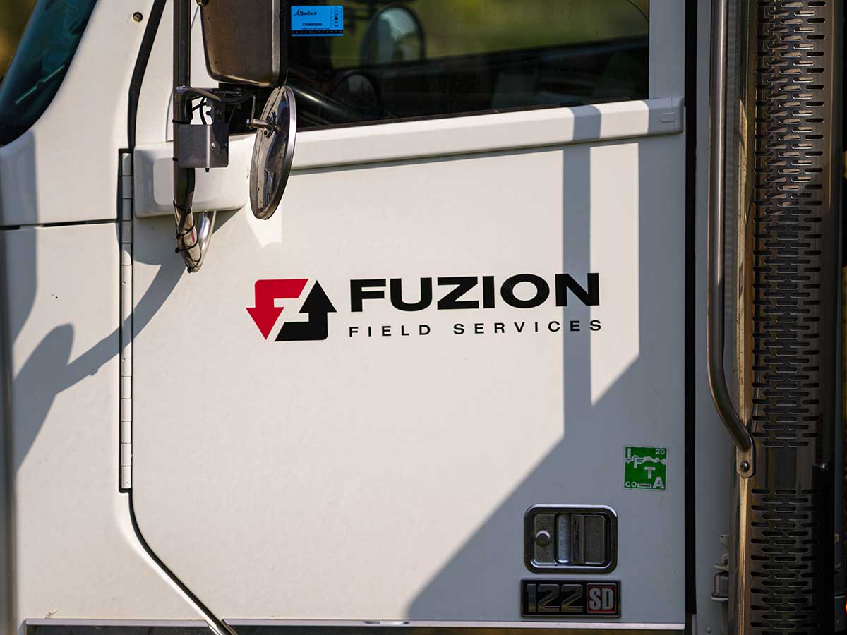 Fuzion Field Services truck parked and ready for work.