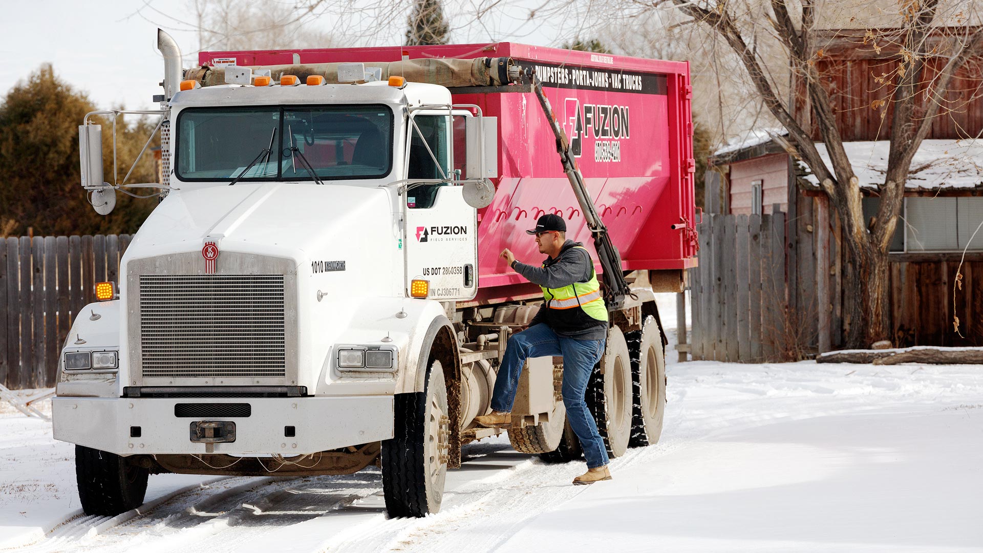 A Fuzion roll-off truck on a route in Denver, CO.