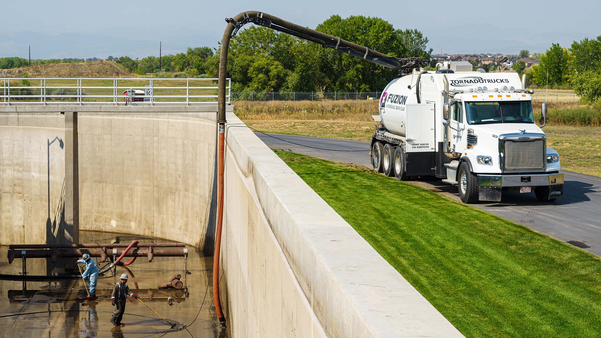 A Fuzion expert and hydrovac truck cleaning up wastewater.