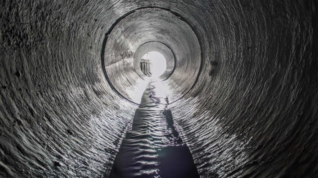 Hydro jetting maintenance keeps water flowing freely through concrete drainage pipes.
