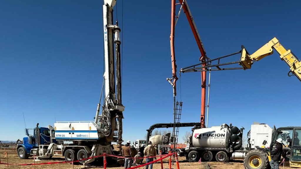 Fuzion Hydrovac Truck Digging Holes for Pylons on a Construction Site