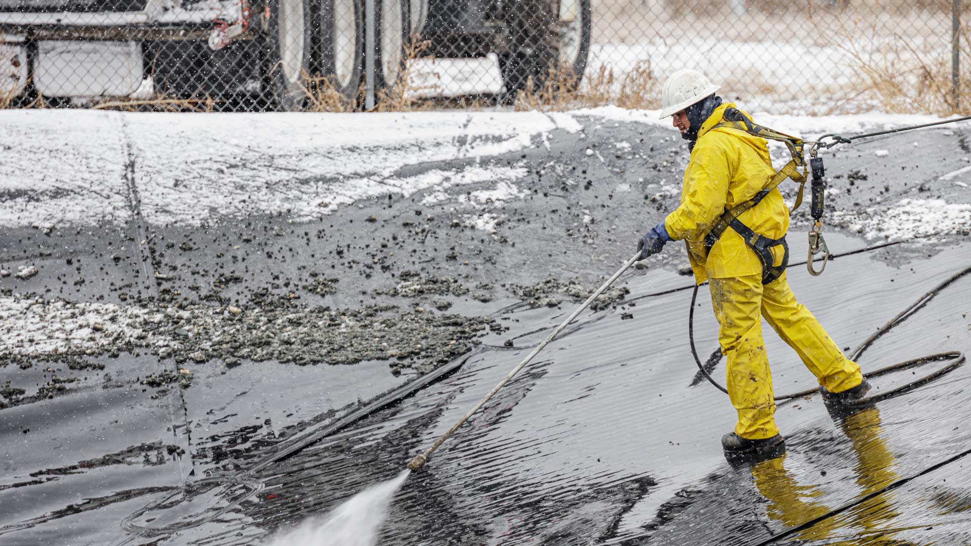 Fuzion worker cleaning up a spill.