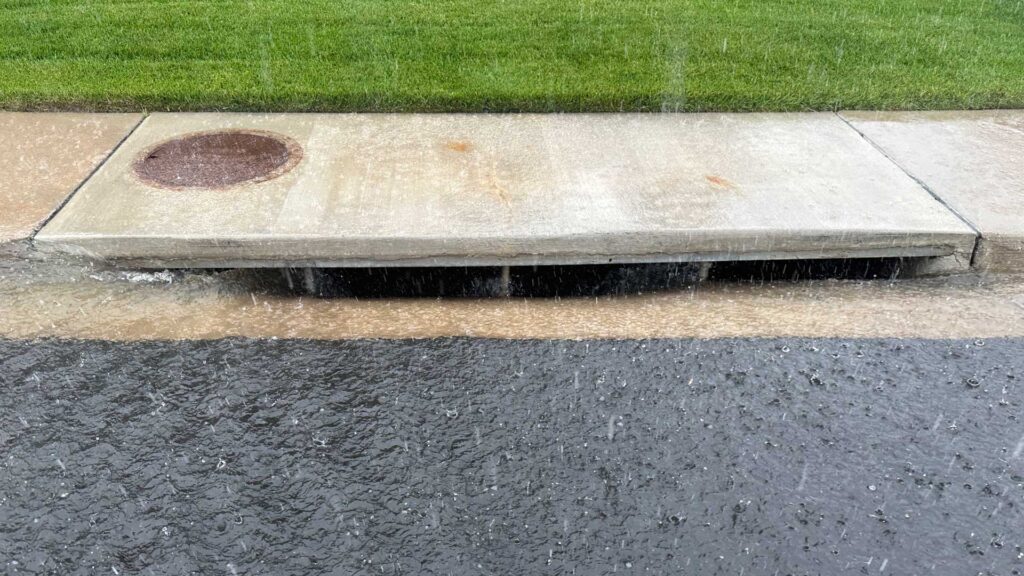 Water flows freely into a well maintained stormwater drainage system.