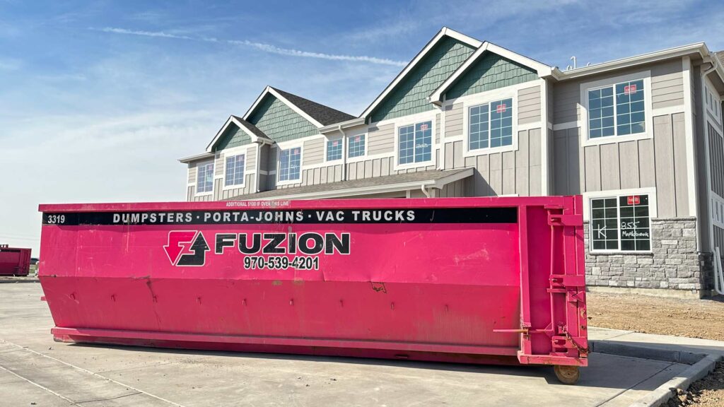 A Fuzion dumpster rental at a large-scale project.