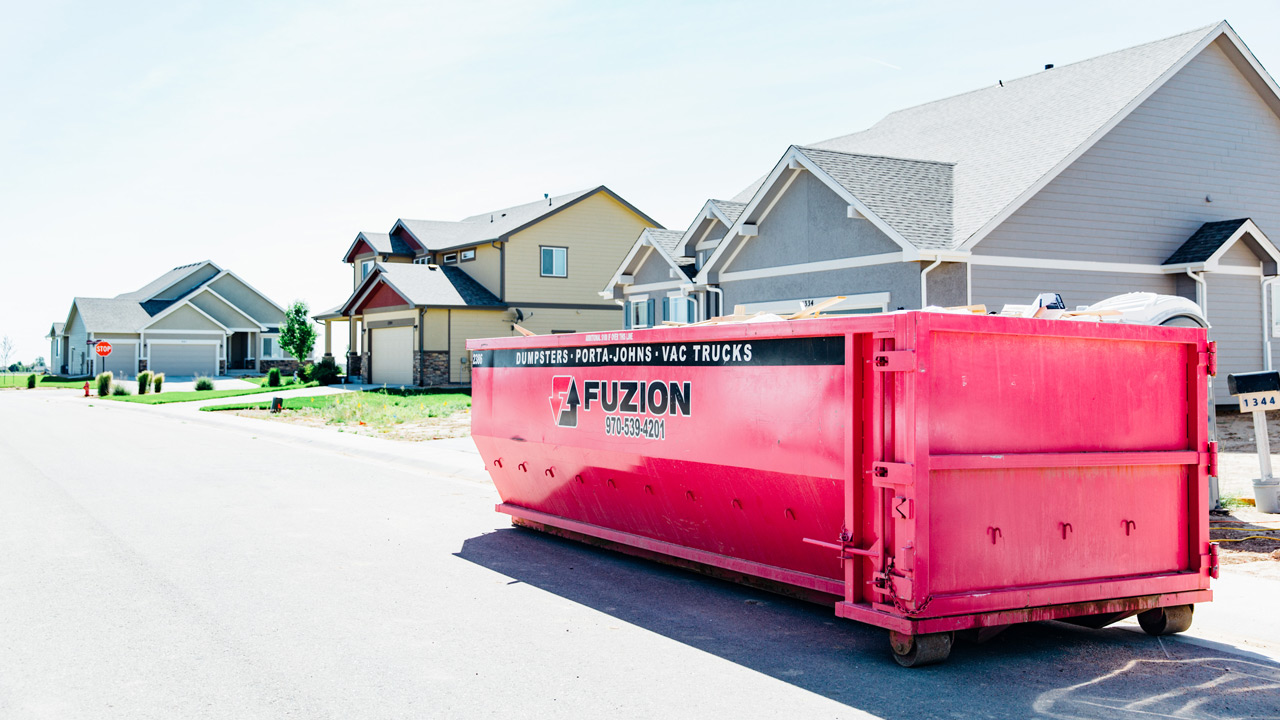 Fuzion dumpster on the site of a new home development