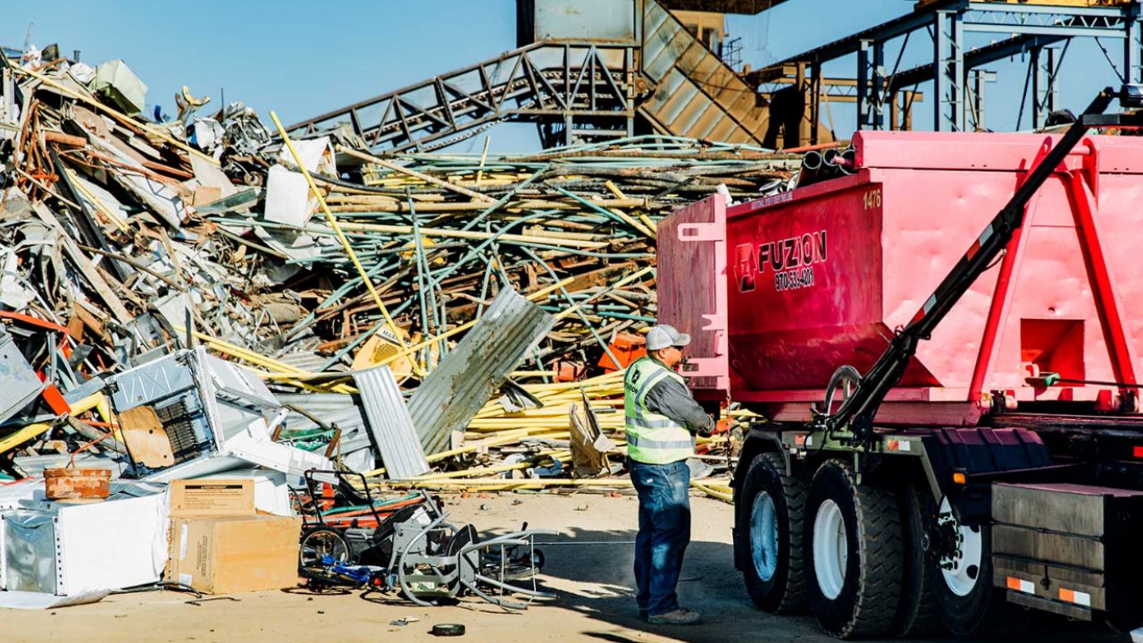 Fuzion Field Services truck hauling scrap metal.