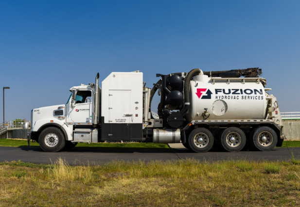 A Fuzion truck parked outside a jobsite. 