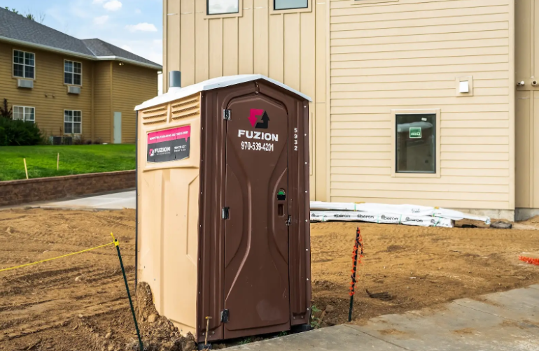 Fuzion portable toilet on a construction site.