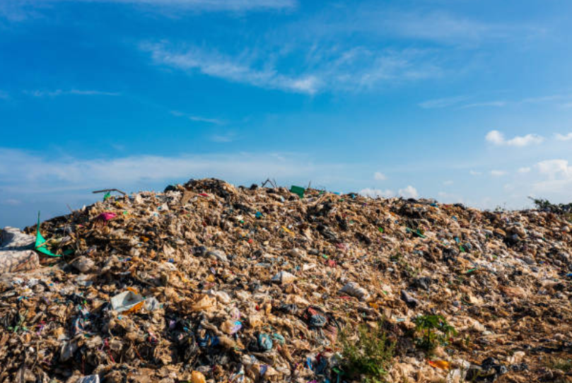 Large landfill site used to illustrate compost vs landfill environmental impact.