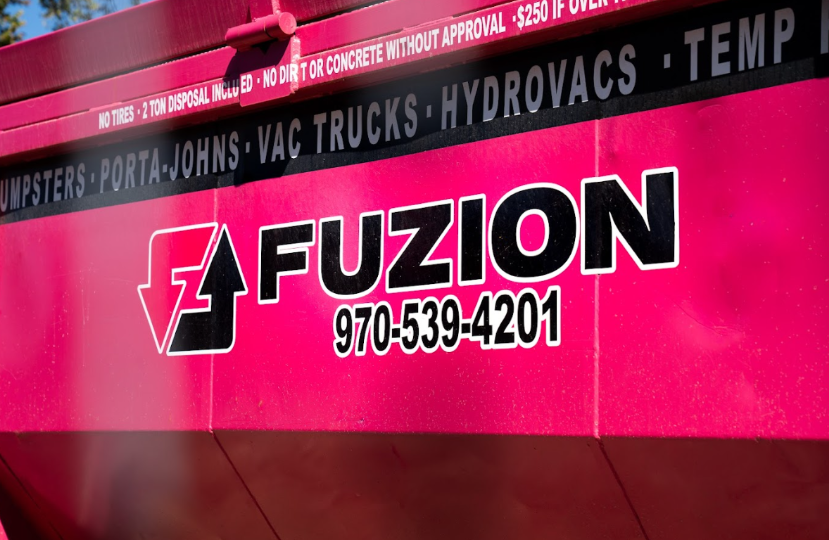 Close up of a Fuzion dumpster used for professional dumpster trash removal services.
