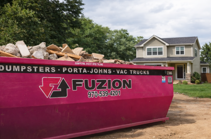 Fuzion dumpster filled with debris, showing dumpster weight limits.